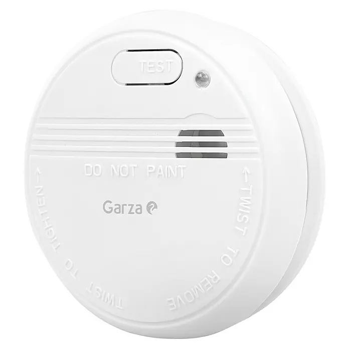 Garza Detector de humo Standart - Diámetro: 10,3 cm, Duración de batería: 5 años, Señal de alarma: 85 dB - Un detector de humo redondo y blanco con las inscripciones "TEST" y "DO NOT PAINT" para mayor seguridad en el hogar.