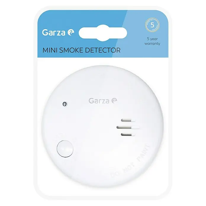 Garza Detector de humo Mini - Diámetro: 7,2 cm, Duración de batería: 5 años, Señal de alarma: 85 dB - Imagen del producto de un mini detector de humo Garza blanco en su embalaje, con una garantía de 5 años.