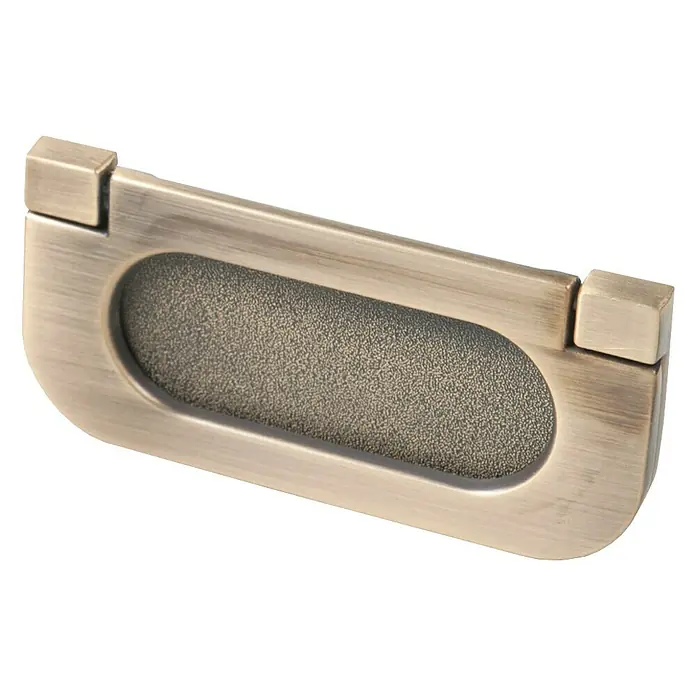 Nesu Tirador para muebles 885418 - L x An x Al: 7,5 x 3,5 x 0,5 cm, Latón envejecido - Primer plano de una manija empotrada para puerta corredera de color bronce con un rebaje de agarre oblongo y líneas limpias.