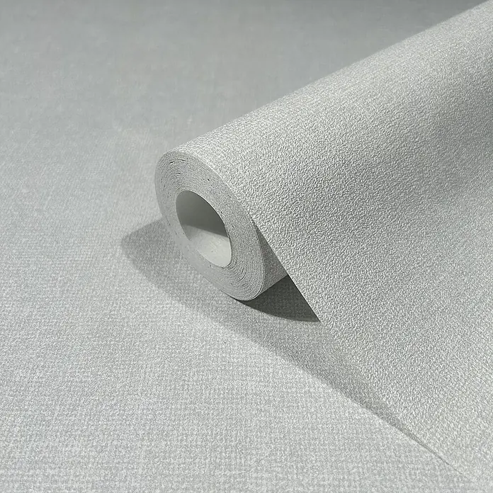 Marburg Struktura Vliestapete Struktur - Hellgrau, Uni, 10,05 x 0,53 m - Nahaufnahme einer Rolle grauer Texturtapete, die ein subtiles und elegantes Design für die Inneneinrichtung zeigt.
