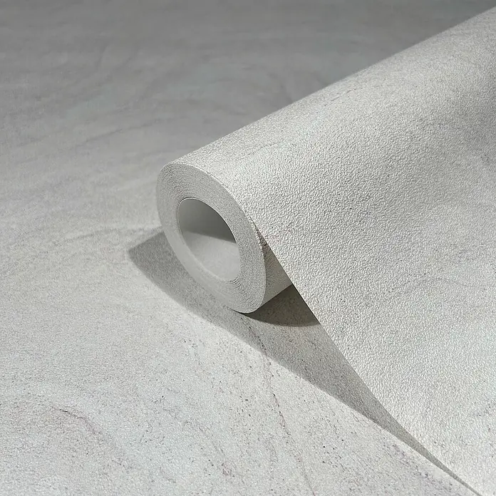 Marburg Struktura Vliestapete Marmoroptik - Grau/Rosa, Steinoptik, 10,05 x 0,53 m - Nahaufnahme einer Rolle grauer Tapete mit einer subtilen Textur, die eine elegante und moderne Ästhetik für Innenräume bietet.