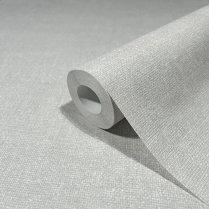 Marburg Struktura Vliestapete Struktur - Cremegrau, Uni, 10,05 x 0,53 m - Nahaufnahme einer Rolle grauer Tapete mit feiner Textur, ideal für moderne Raumgestaltung und Wanddekoration.