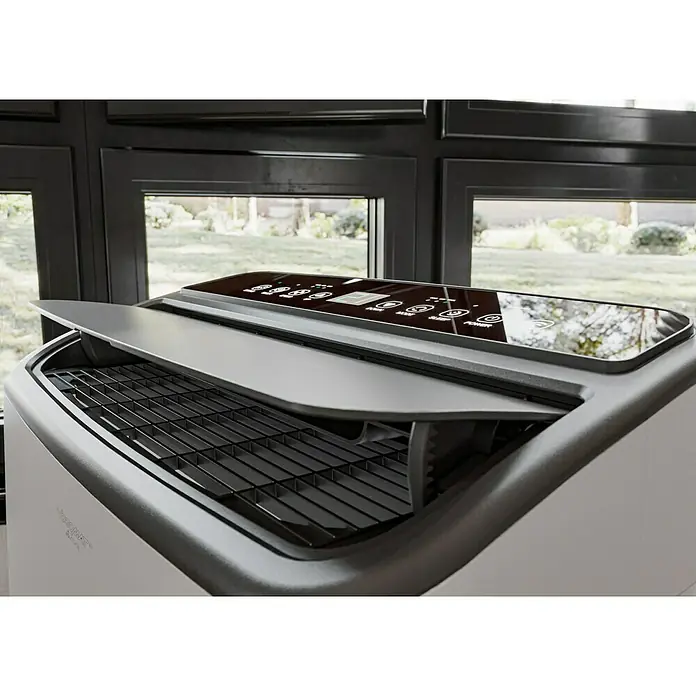Voltomat Aire acondicionado portátil Yakutsk - 5.200 W, Tamaño de la estancia: 52 m², Blanco - Primer plano de un purificador de aire con un compartimento abierto, mostrando una estructura de rejilla y un panel de control moderno.