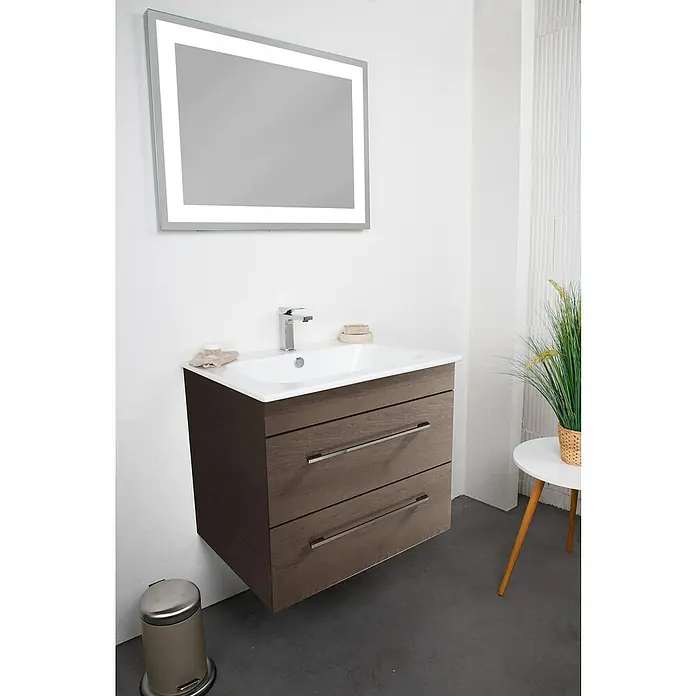 Lanzet K5 Badmöbel-Set K57E1 - 67,9 cm, Eiche Maron - Das Bild zeigt ein modernes Badezimmer-Waschbecken mit Unterschrank und beleuchtetem Spiegel, das Design und Funktionalität vereint.