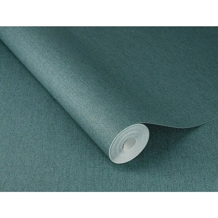 SCHÖNER WOHNEN-Kollektion Cosyliving Vliestapete LINEN - Petrol, Uni, 10,05 x 0,53 m - Nahaufnahme einer Rolle türkisfarbener Textiltapete mit dezenter Struktur, die eine ruhige und stilvolle Atmosphäre verspricht.