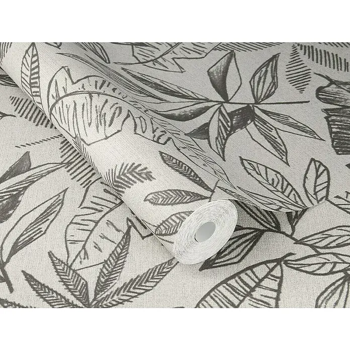 SCHÖNER WOHNEN-Kollektion Cosyliving Vliestapete LEAFAGE Blätter - Naif-Grau-Anthrazit, Floral, 10,05 x 0,53 m - Nahaufnahme einer Rolle grauer Tropical-Blätter-Tapete mit exotischen botanischen Mustern, die eine beruhigende natürliche Atmosphäre schaffen.