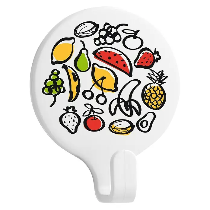 Inofix Colgador adhesivo Vegetales - Blanco - Un gancho blanco con un estampado frutal, perfecto para la cocina o el baño. El gancho es ideal para colgar toallas o utensilios de cocina.