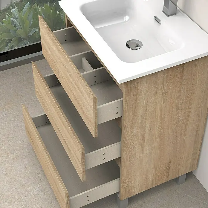 Artysan Conjunto de mueble de baño Atila - Ancho: 60 cm, Roble bardolino, 3 pzs. - Imagen de un mueble de baño con tres cajones abiertos, decoración de madera clara y un lavabo sobre encimera blanco.