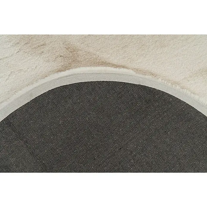 Fellteppich Happy - Elfenbein, 230 x 160 cm, Oval, 100 % Polyester (Flor) - Nahaufnahme eines runden, cremefarbenen Teppichs mit texturiertem Rücken für Bodenhaftung.