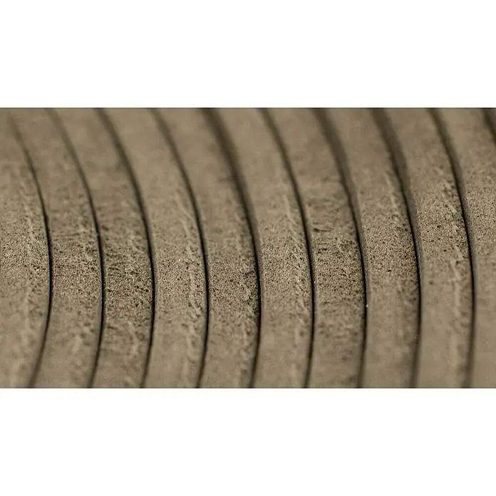 Bur2000 Base aislante Sound 2 - 25 m², Espesor: 2 mm - Primer plano de material aislante gris enrollado. La estructura y la textura del material aislante son claramente visibles.