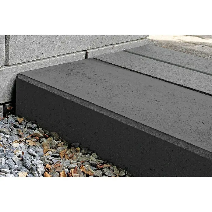 Christoph Blockstufe - Anthrazit, 50 x 32 x 16 cm, Beton, Rechteckig - Nahaufnahme von grauen Pflastersteinen und Kies, die einen robusten und langlebigen Außenbereich zeigen.