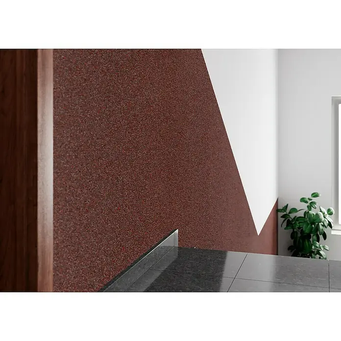 Probau WDVS-Buntsteinputz - Weiß/Rot/Schwarz, 25 kg - Nahaufnahme einer Wand mit einer strukturierten, rotbraunen Beschichtung, die eine einzigartige Textur und ein interessantes Designelement bietet.
