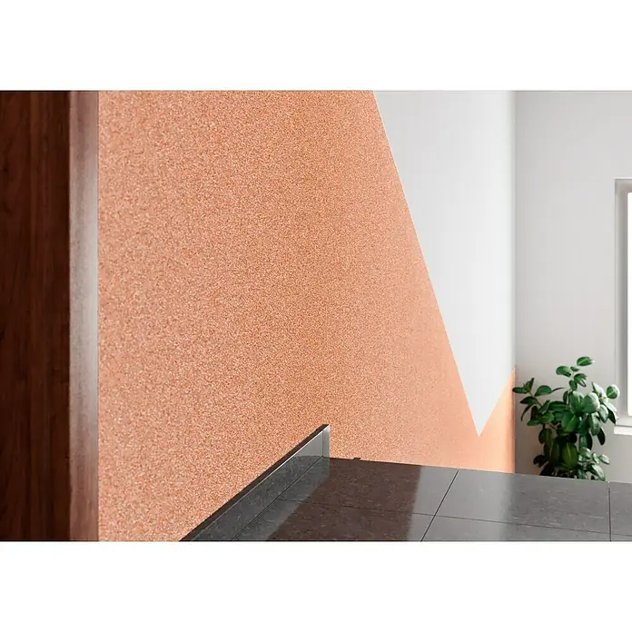 Probau WDVS-Buntsteinputz - Weiß/Orange/Rot, 25 kg - Nahaufnahme einer Wand mit Terrakotta-Textur und einem weißen, dreieckigen Bereich, der ein modernes und stilvolles Design erzeugt.