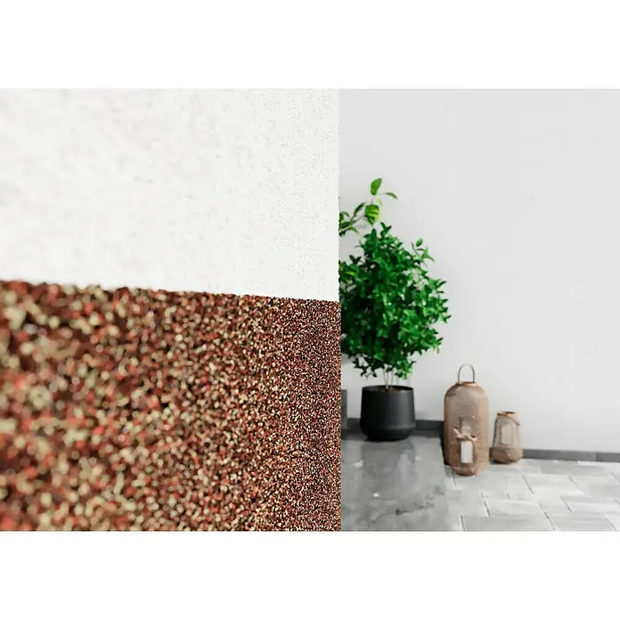 swingcolor Buntsteinputz - Korngröße: 2 - 3 mm, 20 kg, Nr. 52 - Nahaufnahme einer Wand mit einer zweifarbigen Textur, die das einzigartige Design und die Materialbeschaffenheit hervorhebt.
