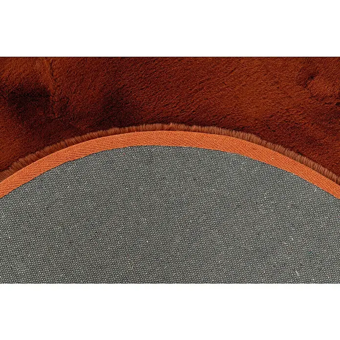 Fellteppich Happy - Terra, 230 x 160 cm, Oval, 100 % Polyester (Flor) - Nahaufnahme der Rückseite eines runden, braunen Teppichs mit einer grauen Unterseite und einem braunen Rand.