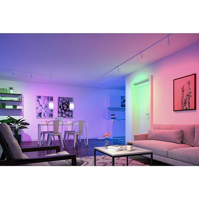 Paulmann Smart-LED-Lampe - E27, Dimmbar, RGBW, 1.055 lm, 11 W, Birne - Wohnzimmer mit intelligenter Beleuchtung, die farbenfrohe Akzente setzt. Moderne LED-Leuchten erhellen den Raum in verschiedenen Farben.