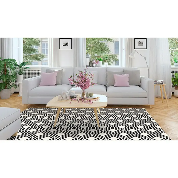 Alfombra de vinilo Living geométrica - Negro, 200 x 140 cm - Una sala de estar elegante con una alfombra moderna con un patrón geométrico, que añade un toque elegante al espacio.