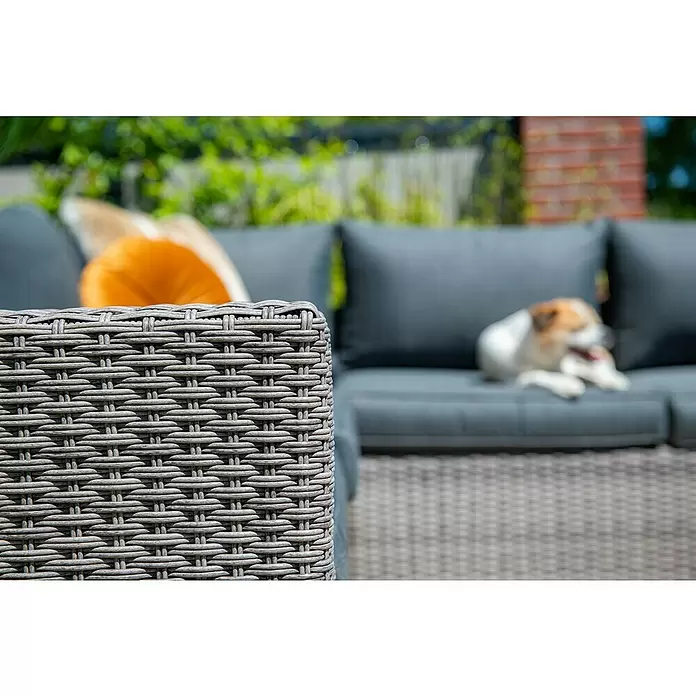Garden Impressions Loungemöbel-Set Orangebird - 4 -tlg., Aluminium, Schwarz/Grau - Graues geflochtenes Gartensofa mit einem entspannenden Hund im Garten.