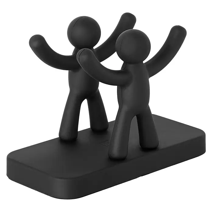 Umbra Serviettenhalter Buddy - 15 x 8 x 11 mm, Schwarz, Kunststoff - Zwei schwarze, stilisierte humanoide Figuren mit erhobenen Armen auf rechteckigem Sockel, wahrscheinlich ein flexibler Handy-/Tablethalter.
