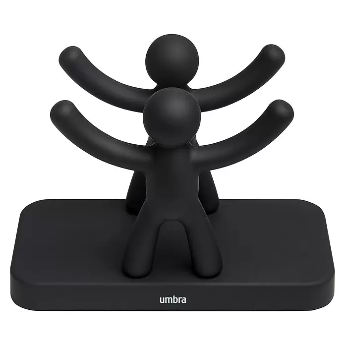 Umbra Serviettenhalter Buddy - 15 x 8 x 11 mm, Schwarz, Kunststoff - Mattschwarzer Halter mit zwei abstrakten Figuren und erhobenen Armen auf rechteckiger Basis.