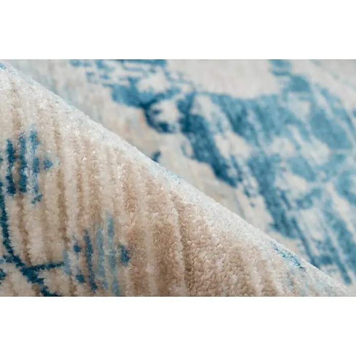 Kayoom Kurzflorteppich Baroque II - Creme/Blau, 150 x 80 cm, 100 % Polyester - Nahaufnahme eines hellen Teppichs mit blauem Muster, der eine weiche und luxuriöse Textur zeigt.