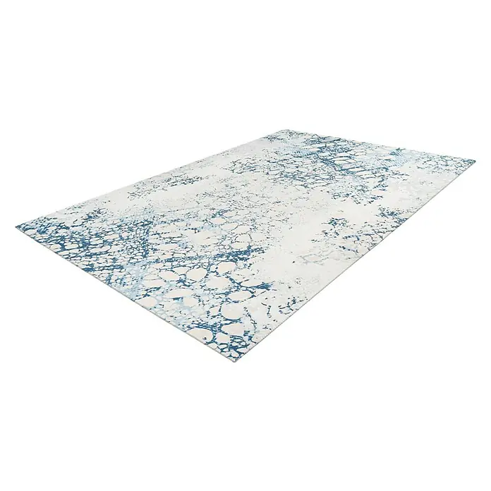 Kayoom Flachgewebeteppich Galaxy - Creme/Blau, 150 x 80 cm, 100 % Polyester - Ein rechteckiger Teppich mit einem abstrakten Muster in Weiß- und Blautönen, ideal für moderne Wohnräume. Der Teppich ist auf schwarzem Hintergrund dargestellt.