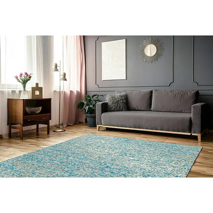 Kayoom Lederteppich Finish - Türkis, 290 x 200 cm, 100 % Leder - Moderner Wohnraum mit einem auffälligen blauen Teppich, der den Raum belebt und einen Hauch von Farbe in das elegante Interieur bringt.
