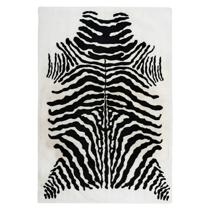 Kayoom Hochflorteppich Zebra - Weiß/Schwarz, 160 x 120 cm, 100 % Polyester - Ein rechteckiger Teppich im Zebra-Look mit schwarzen Streifen auf weißem Grund, der als auffälliges Dekoelement dient.