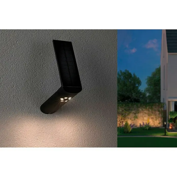 Paulmann Ilias Aplique solar para exterior - 1,2 W, L x An x Al: 17,5 x 7,3 x 26,1 mm, Antracita, IP44 - Una lámpara solar montada en una pared, emitiendo un brillo cálido, perfecto para iluminar espacios exteriores.