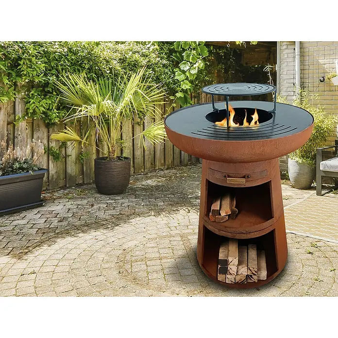 Purline Barbacoa de carbón EFP55CO - Diámetro de la superficie de la parrilla: 60 cm, Óxido - Un brasero rústico con almacenamiento de leña integrado y una parrilla para asar, perfecto para noches acogedoras en el jardín.