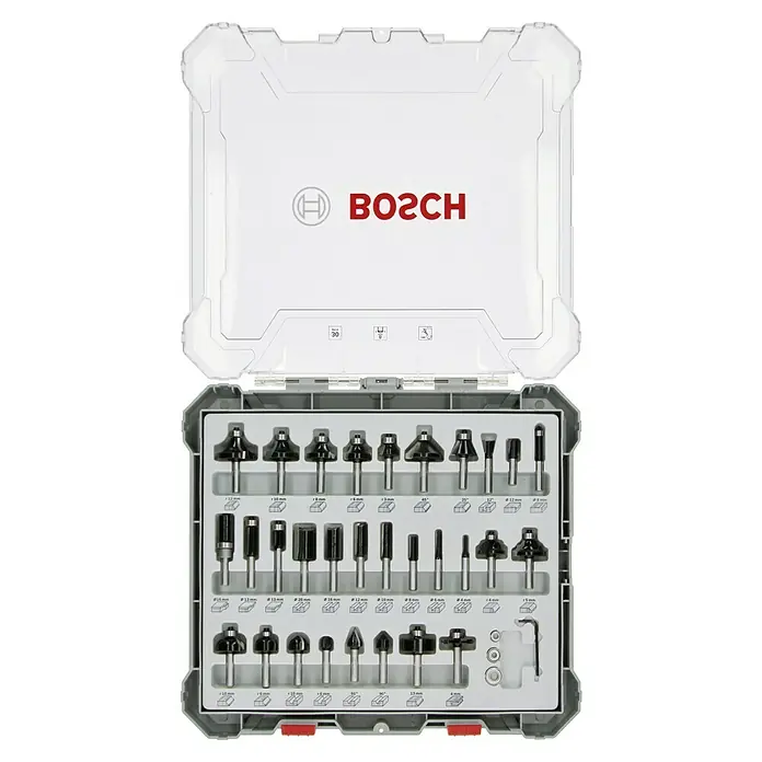 Bosch Fräser-Set Mixed - 30 -tlg., Durchmesser Schaft: 8 mm - Das Bild zeigt ein Bosch-Fräser-Set in einem geöffneten, transparenten Koffer mit verschiedenen Fräsern für Holzbearbeitung.