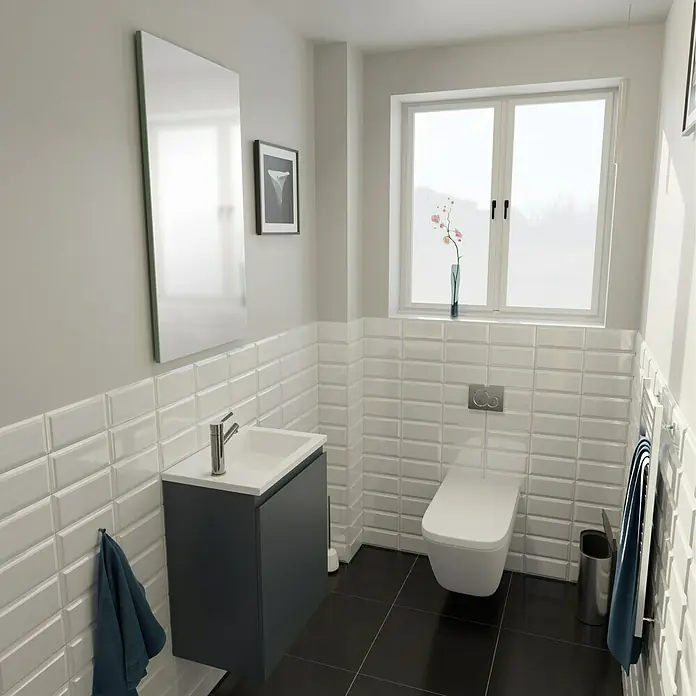 Camargue Espacio Badmöbel-Set C4 - 50 cm, Gama anthrazit matt - Ein Badezimmer mit einem modernen Waschtisch in Anthrazit, einer Toilette und weißen Metrofliesen, die eine stilvolle und funktionale Einrichtung schaffen.