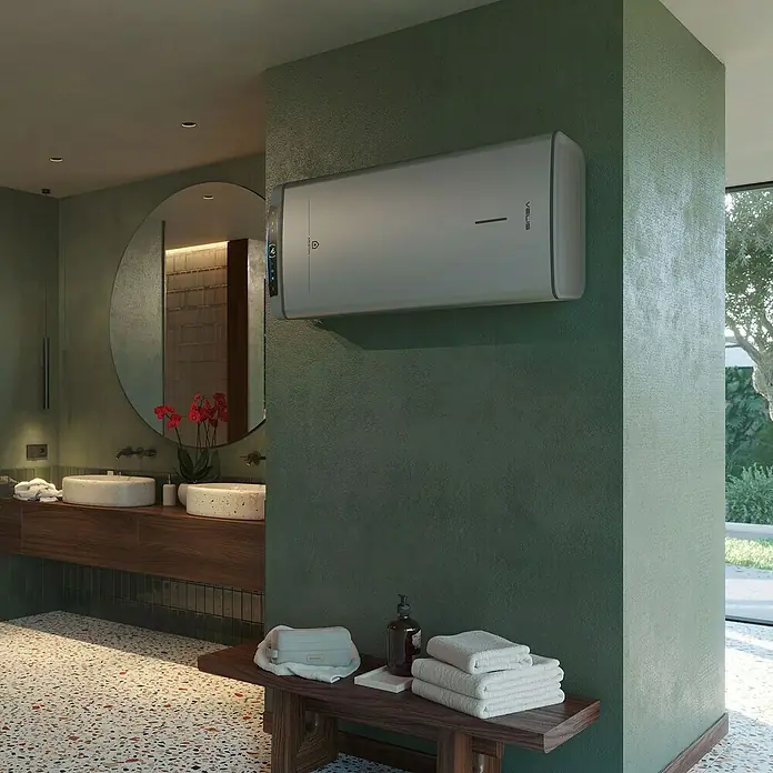 Ariston Termo eléctrico reversible Velis Tech Dry Wifi - 100 l, 1.500 W, Montaje en la pared - Un moderno calentador de agua Velis está montado en una pared verde en un elegante baño, lo que garantiza un suministro eficiente de agua caliente.