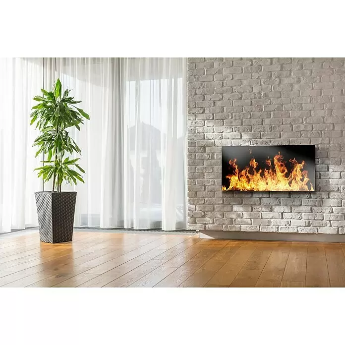 Papermoon Infrarot-Glasbildheizkörper Open Fire - 66 x 126 cm, 750 W - Wandmontiertes Paneel mit realistischem Flammeneffekt an einer weißen Ziegelwand in einem modernen Raum.