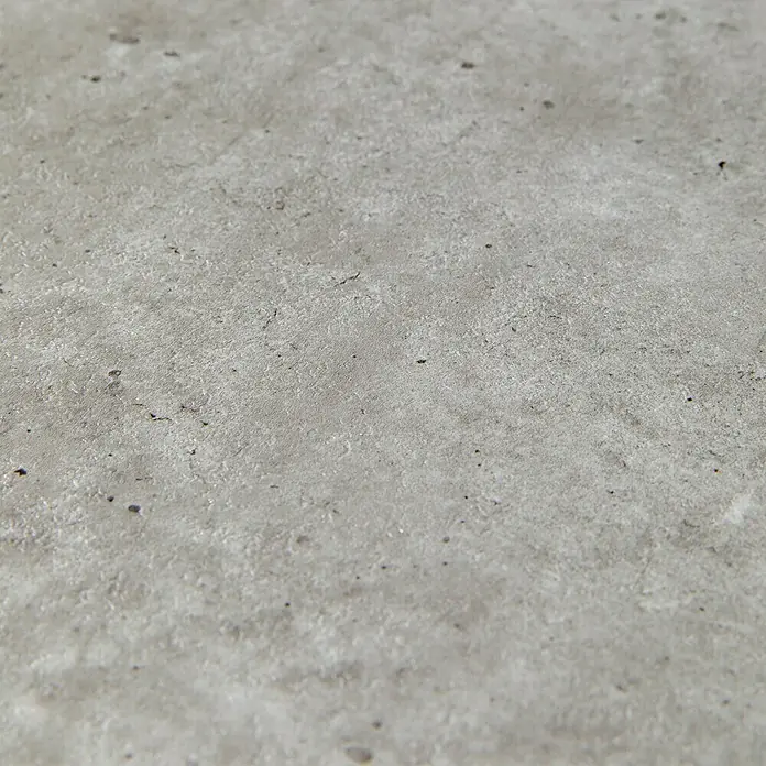 Grosfillex Wall+ Wandpaneel - Grey Concrete, 600 x 300 x 5 mm - Detailaufnahme einer grauen Betonoberfläche mit feinen Unregelmäßigkeiten und einer leichten Textur. Ideal für Hintergründe.