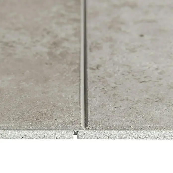 Grosfillex Wall+ Wandpaneel - Grey Concrete, 600 x 300 x 5 mm - Nahaufnahme von aneinander liegenden Paneelen. Die Nut- und Federverbindung ist sichtbar.