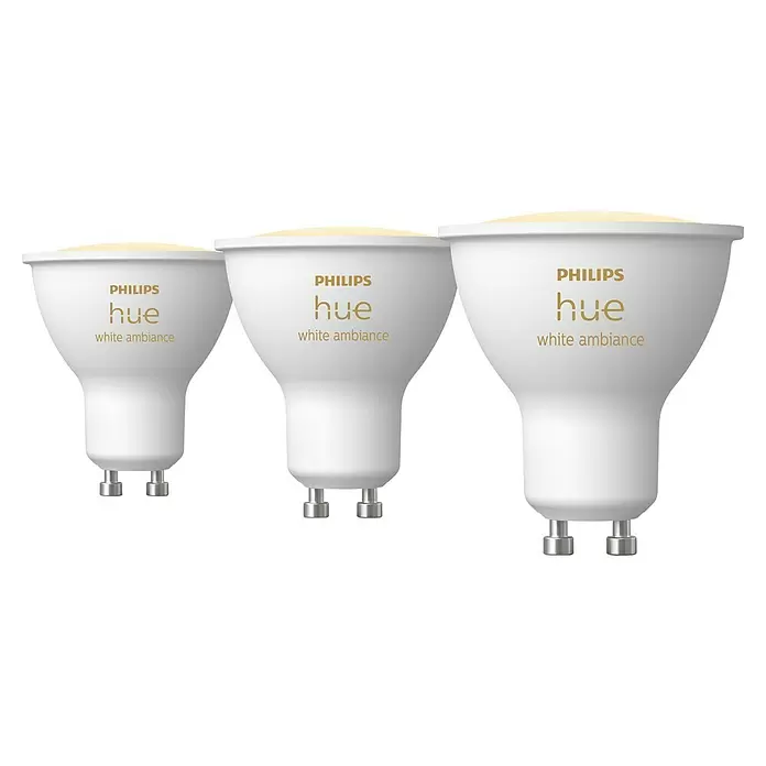Philips Hue Smart-LED-Lampe White Ambiance - GU10, Dimmbar, Mehrfarbig, 400 lm, 4,2 W, 3 Stk. - Drei weiße Philips Hue GU10 Smart Spotlampen mit "white ambiance"-Text in Gold.
