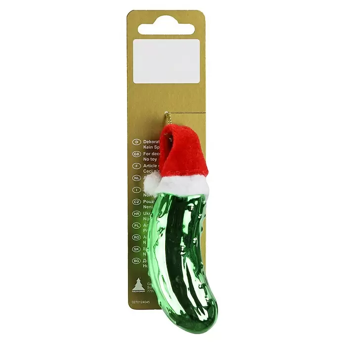Christbaumschmuck Gurke - Grün, Glas, 1 Stk. - Grüne Gurken-Weihnachtskugel mit roter Weihnachtsmannmütze und goldener Aufhängung.