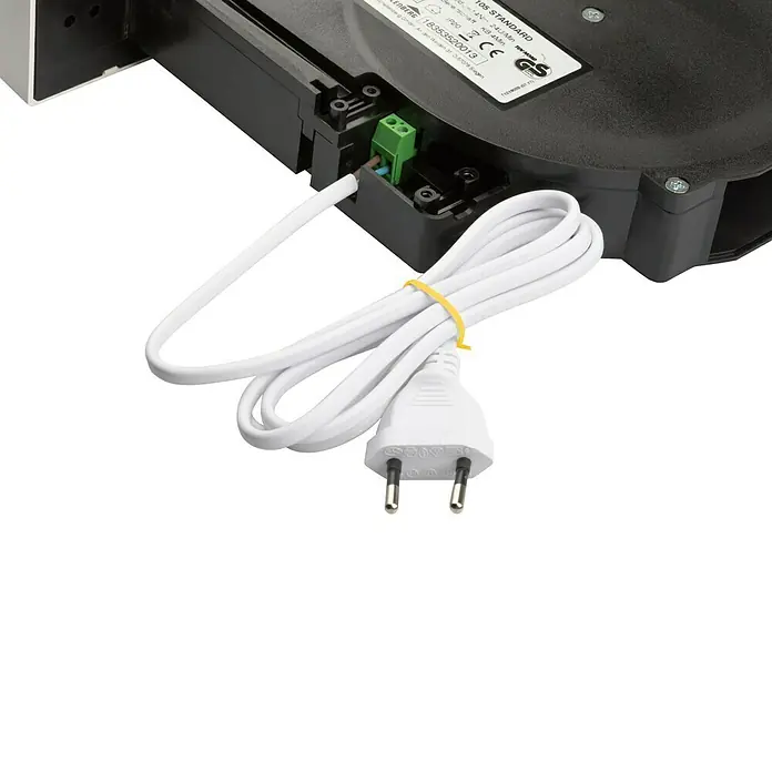 Schellenberg Recogedor de cinta de persiana Rollo Drive 65 Standard - Fuerza de tracción: 45 kg, Anchura de la correa: 23 mm, Empotrado - Primer plano del producto estándar Leuchtberg, que muestra un cable blanco con un enchufe, garantizando una conectividad fiable.