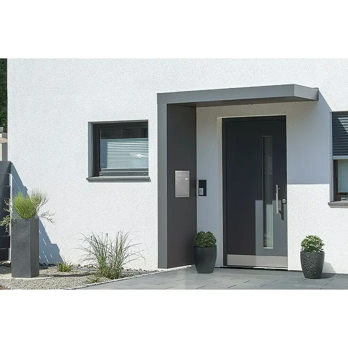 Gutta Rechteckvordach BS Plus 200 UP ST BK - 200 x 90 x 15,5 cm, Seitenteil links, Briefkasten Edelstahl - Nahaufnahme einer modernen Haustür mit Briefkasten und Überdachung.