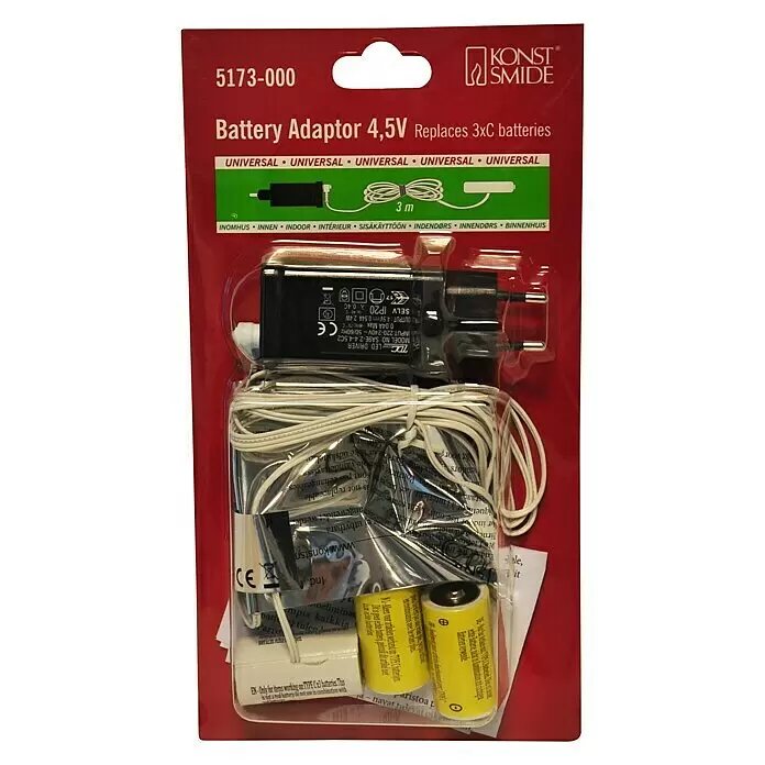 Konstsmide Netzadapter für C-Batterien - Batterietyp: Baby C - Batterieadapter 4,5V als Ersatz für 3 C-Batterien, schwarz mit weißen Kabeln und gelben Blindbatterien, in roter Verkaufspackung.