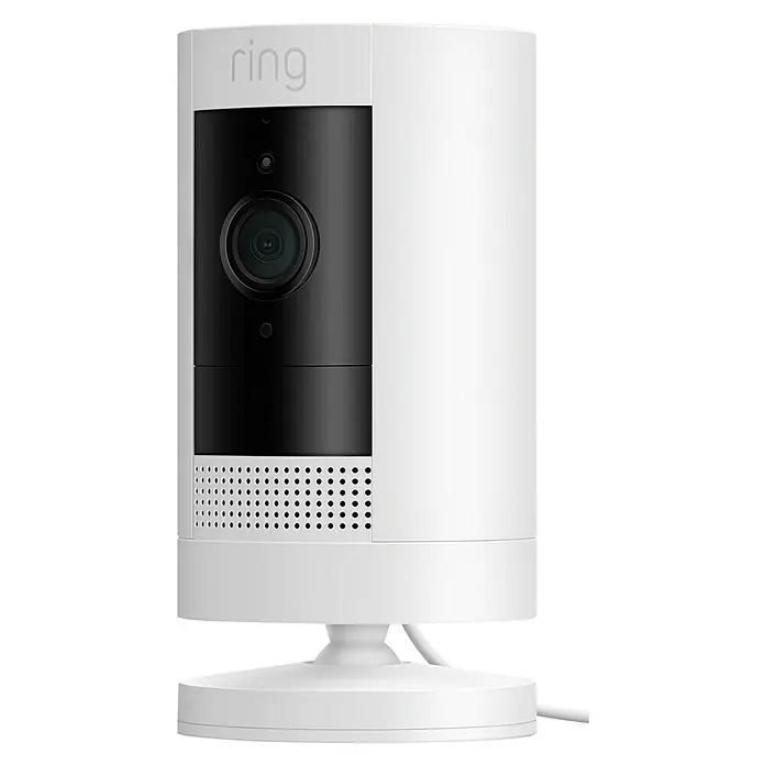 Ring Überwachungskamera außen Stick Up Cam Plug-In - Netzbetrieben, 1.080 Pixel (Full HD), Weiß - Eine Nahaufnahme einer Ring Stick Up Cam Batterie in Weiß. Die Kamera ist zylindrisch mit einer schwarzen Kameraplatte.