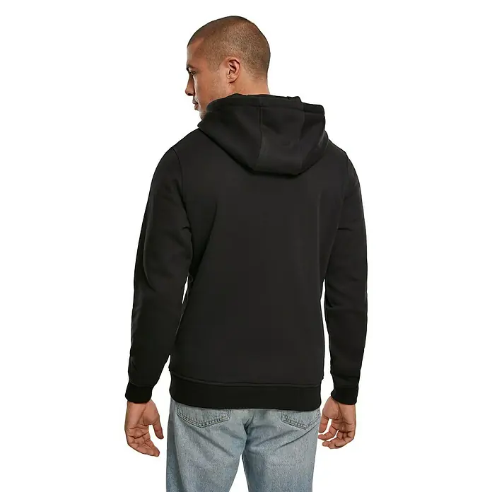 Kapuzenpullover Handcrafter - Schwarz, Größe: XXL - Rückansicht eines Mannes in einem schwarzen Kapuzenpullover und Jeans, der das schlichte Design und die Passform des Hoodies zeigt.