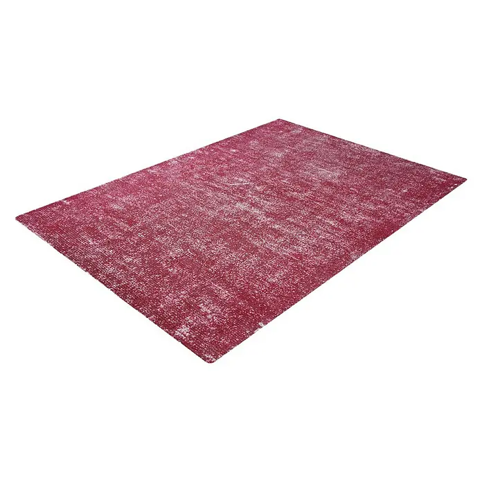 Kayoom Kurzflorteppich Etna - Melone, 230 x 160 cm, 100 % Mikropolyester - Dieser Teppich hat ein abstraktes Muster in einem warmen, rötlichen Farbton mit subtilen weißen Akzenten. Er ist auf einem neutralen Hintergrund abgebildet.