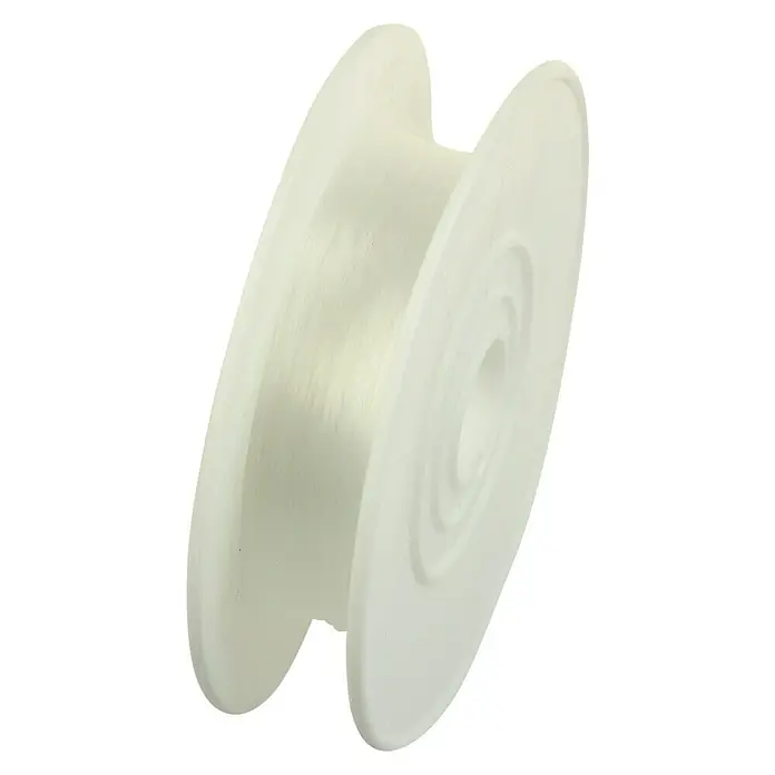 Stabilit Perlondraht - Ø x L: 0,7 mm x 50 m, Transparent - Nahaufnahme einer Spule mit durchsichtigem Faden, ideal für verschiedene Bastel- und Nähprojekte. Vielseitig und hochwertig.