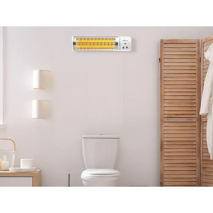 Purline Calefactor halógeno Heaty B1200 - 10,5 x 63 x 15 cm - La imagen muestra un calentador infrarrojo montado en una pared de baño, que proporciona calor eficiente.