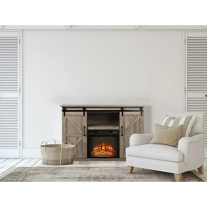 Purline Chimenea eléctrica con marco MDF CHE-910 - Marrón, 2.000 W, 40 x 137 x 82 cm - Imagen de un mueble de TV rústico con puertas correderas tipo granero, con una chimenea eléctrica debajo, junto a un sillón y una cesta.