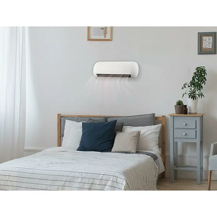 Purline Calefactor de aire Split HOTI M55 - 2.000 W, Blanco - Aire acondicionado de pared en un dormitorio.