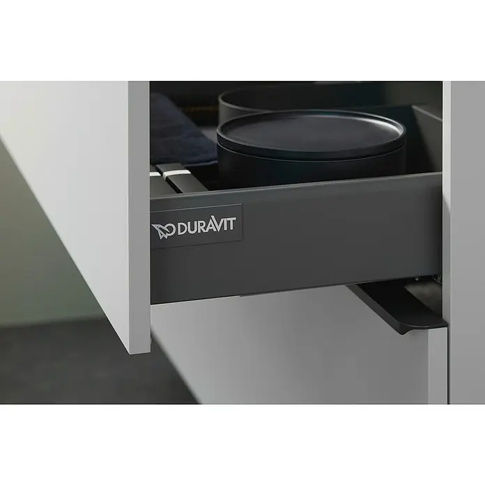 Duravit Waschtischunterschrank D-Neo - 58,4 x 45,2 x 62,5 cm, Weiß - Detailaufnahme eines Duravit Schubladensystems mit dunkler Innenausstattung und dem Duravit Logo. Ein modernes Design für stilvolle Badezimmer.