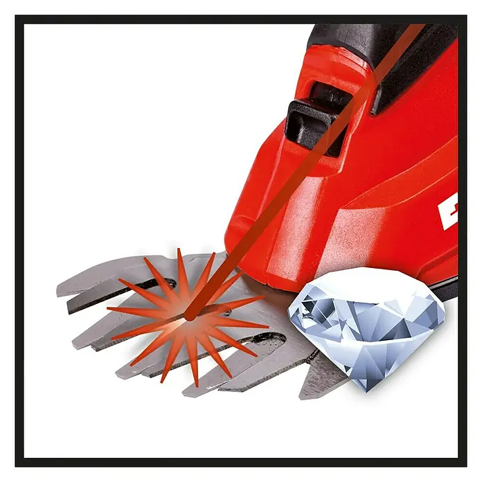 Einhell Power X-Change 18V Akku-Gras- & Strauchschere GC-CG 18 Li-Solo - 18 V, Li-Ionen, Ohne Akku, 100 mm - Nahaufnahme einer Heckenschere, die einen Diamanten schneidet und dabei einen Lichtstrahl erzeugt, um die Präzision der Arbeit zu betonen.